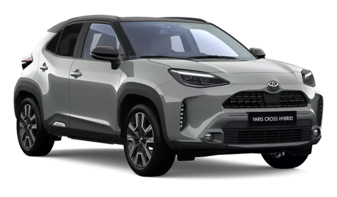 Srebrny Toyota Yaris Cross Hybrid 2025 z czarnym dachem, nowoczesnymi światłami i stylowymi felgami.